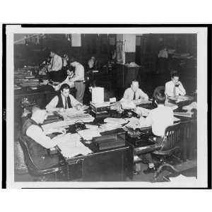  Men working in the newsroom of The New York World Telegram 