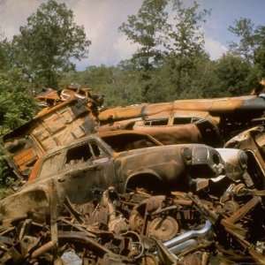 Pile of Rusted Car Shells in an Automobile Junkyard Photographic 