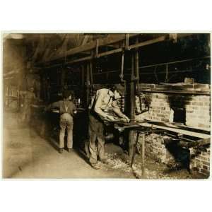 Photo Putting Bottles into the Annealing Oven. An Indianapolis Glass 