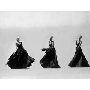 Triple Image of Model Demonstrating Swirling Motion of Black Taffeta 