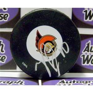  Tyler Arnason autographed Hockey Puck (Ottawa Senators 