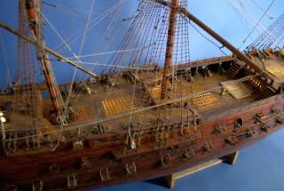 The mass and rigging are tall and intricately constructed. One of the 