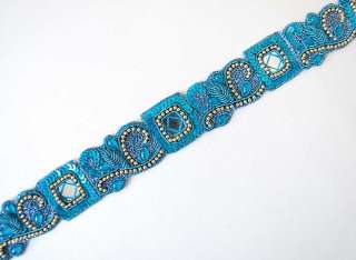 are turquoise tambour embroidery chain stitch done with a hook in blue 