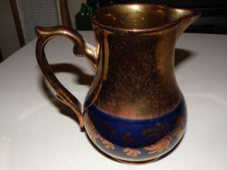 Beautiful Copper Lusterware pitcher with cobalt accents  