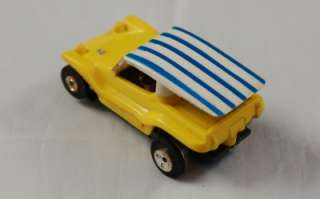 Here we have a vintage Aurora Tuff Ones Dune Buggy slot car. Yellow 