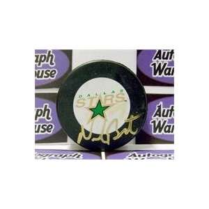   Neal Broten autographed Hockey Puck (Dallas Stars)