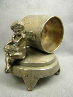 Antique Figural Silverplate Napkin Ring   Winged Cherub Leaning On 