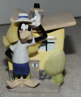 Goofy standing outside his house (still has packing material around 