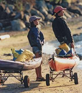 Kayak/Canoe Cart with Tuff Tire Wheels at the beach with two people 