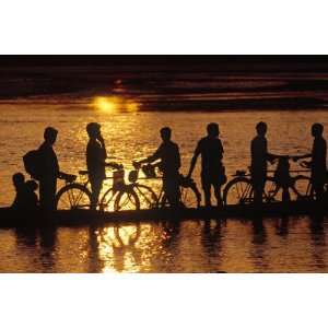 Silhouette of People on Boat on River, Chitwan National Park, Nepal by 