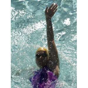  Young Woman Swimming the Backstroke in a Swimming Pool 
