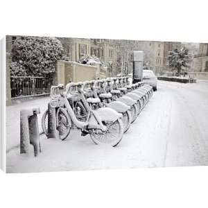 Rows of hire bikes in snow, Notting Hill, London, England 